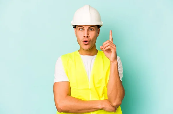 Young Laborer Caucasian Man Isolated Blue Background Having Some Great — Stock Photo, Image