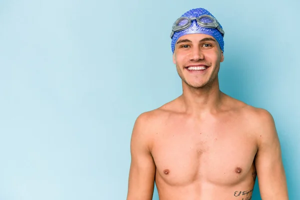 Young Caucasian Swimmer Man Isolated Blue Background — Zdjęcie stockowe