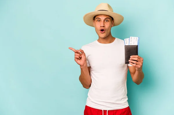 Young Caucasian Traveler Man Holding Passport Isolated Blue Background Pointing — Stock Photo, Image