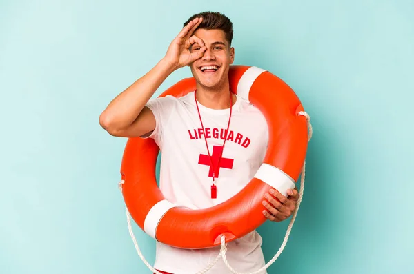 Young Caucasian Lifeguard Isolated Blue Background Excited Keeping Gesture Eye —  Fotos de Stock