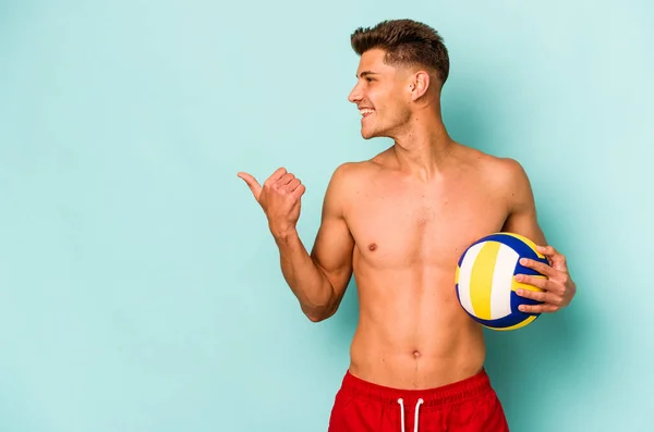 Young Caucasian Man Playing Volley Isolated Blue Background Points Thumb — Stok fotoğraf