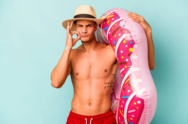 Young Caucasian Man Holding Inflatable Donut Isolated Blue Background Fingers — Stock fotografie