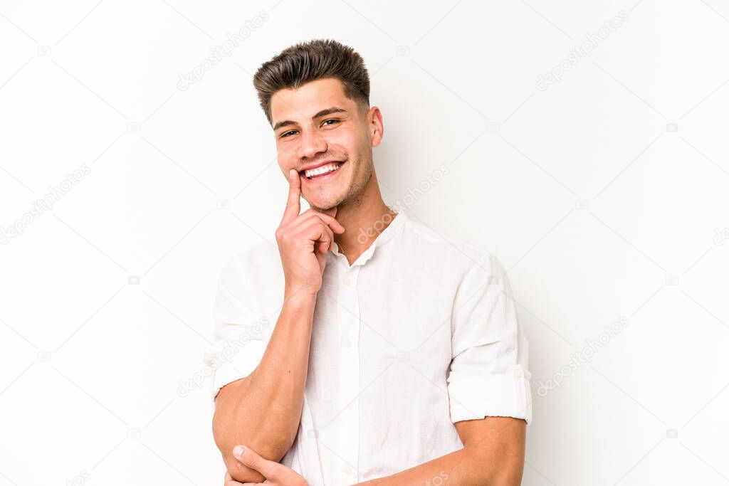 Young caucasian man isolated on white background smiling happy and confident, touching chin with hand.