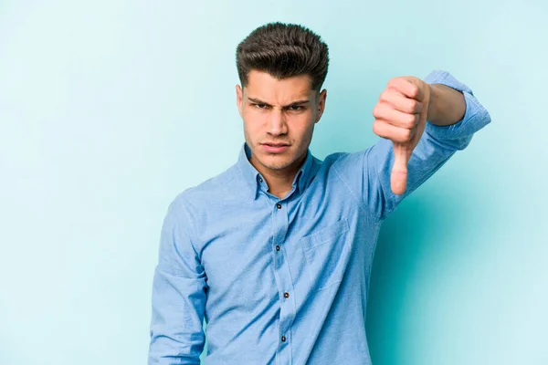 Young Caucasian Man Isolated Blue Background Showing Thumb Expressing Dislike — Stock Photo, Image