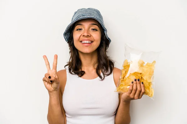 Young Hispanic Woman Holding Bag Chips Isolated White Background Showing — Foto Stock