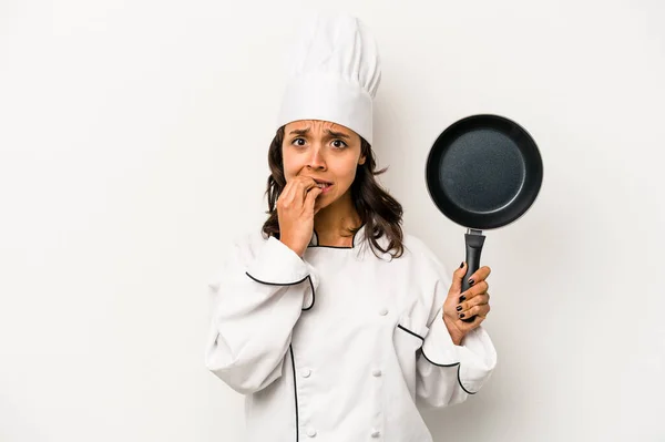 Young Hispanic Chef Woman Isolated White Background Biting Fingernails Nervous — Stockfoto