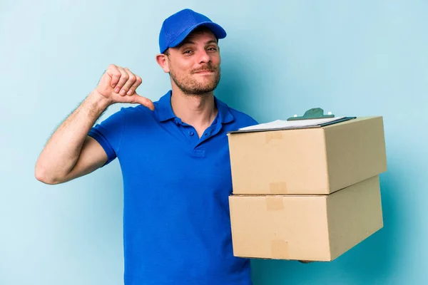 Young Caucasian Delivery Man Isolated Blue Background Feels Proud Self — Stockfoto
