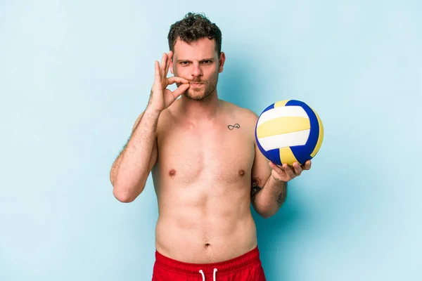 Young Caucasian Man Playing Volley Isolated Blue Background Fingers Lips — Stok fotoğraf