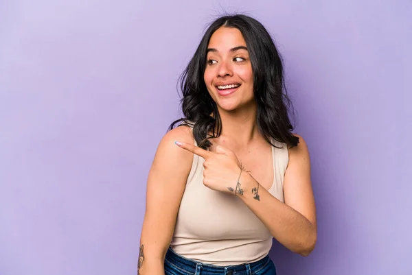 Young Hispanic Woman Isolated Purple Background Looks Aside Smiling Cheerful — Stock Photo, Image