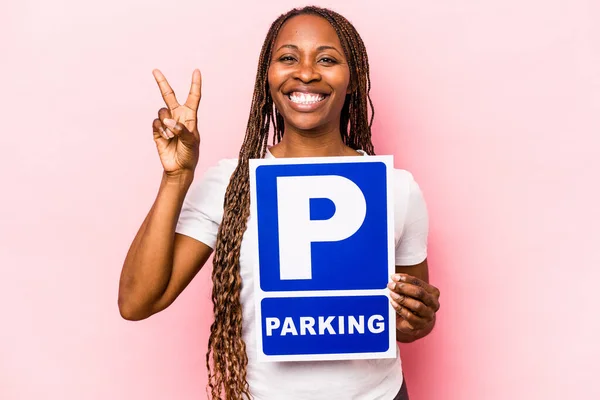 Young African American Woman Holding Parking Placard Isolated Pink Background — Stock Photo, Image