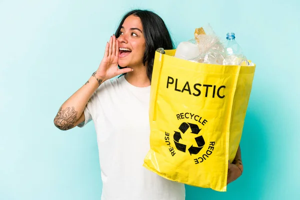 Young Hispanic Woman Recycling Plastic Isolated Yellow Background Shouting Holding — стоковое фото