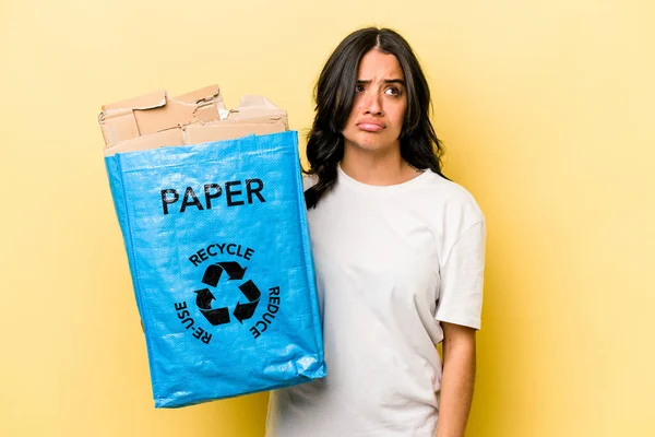 Young Hispanic Woman Recycling Paper Isolated Yellow Background Confused Feels — Stock fotografie