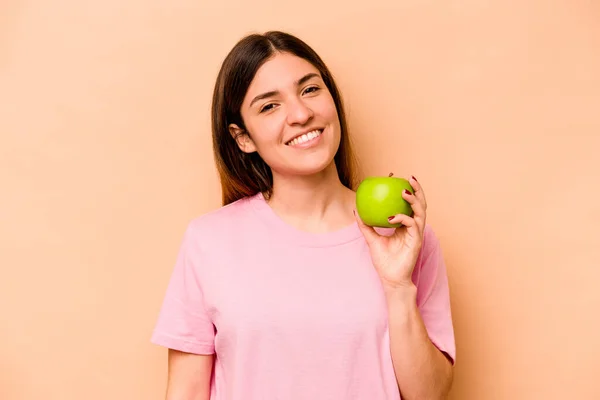 Young Hispanic Woman Holding Apple Isolated Beige Background Happy Smiling — Stock Photo, Image