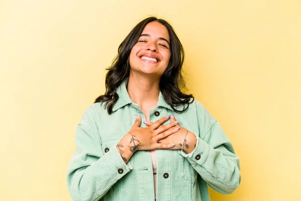 Young Hispanic Woman Isolated Yellow Background Laughing Keeping Hands Heart — Foto Stock