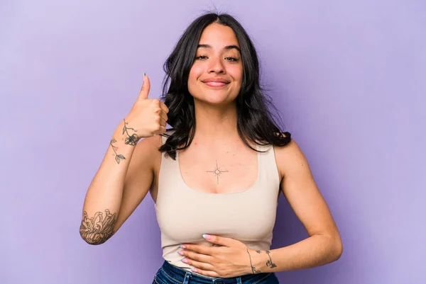 Young Hispanic Woman Isolated Purple Background Touches Tummy Smiles Gently — 스톡 사진
