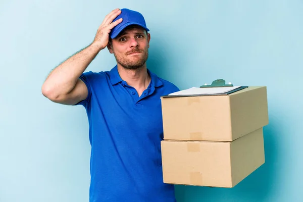 Young Caucasian Delivery Man Isolated Blue Background Being Shocked She — Foto de Stock