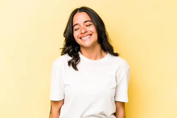 Young Hispanic Woman Isolated Yellow Background Laughs Closes Eyes Feels — 스톡 사진
