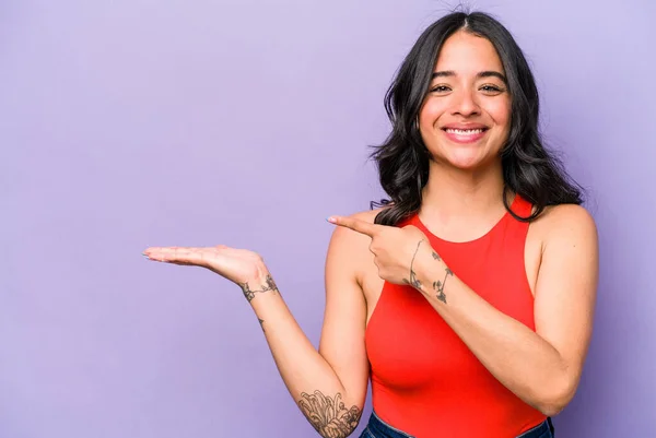 Young Hispanic Woman Isolated Purple Background Excited Holding Copy Space — 스톡 사진