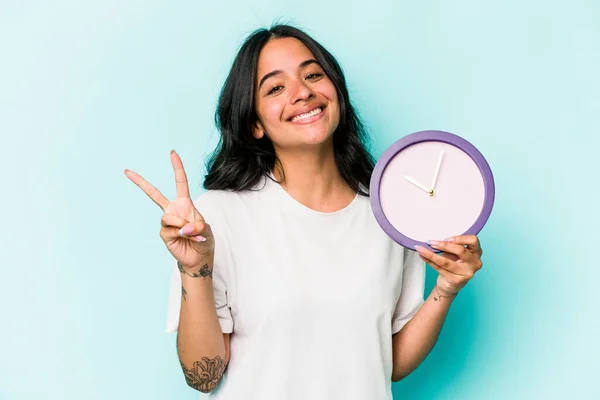 Young Hispanic Woman Holding Clock Isolated Blue Background Joyful Carefree — Fotografia de Stock