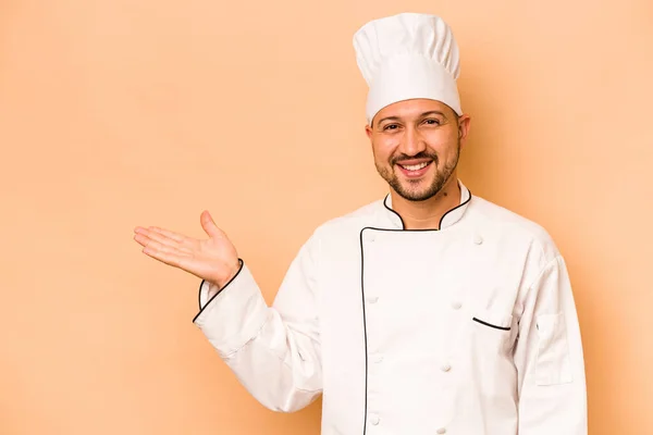 Hispanic Chef Man Isolated Beige Background Showing Copy Space Palm — Stockfoto