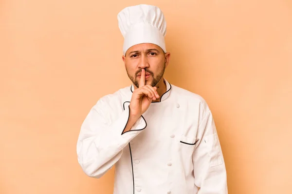 Hispanic Chef Man Isolated Beige Background Keeping Secret Asking Silence — Zdjęcie stockowe