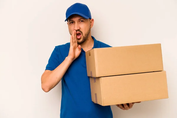 Hispanic Delivery Man Isolated White Background Saying Secret Hot Braking — Stockfoto