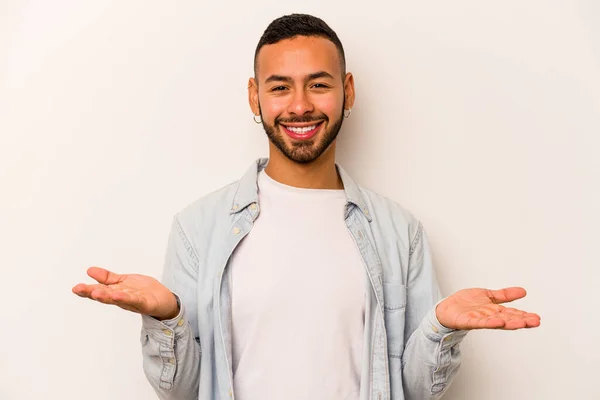 Young Hispanic Man Isolated White Background Makes Scale Arms Feels — ストック写真