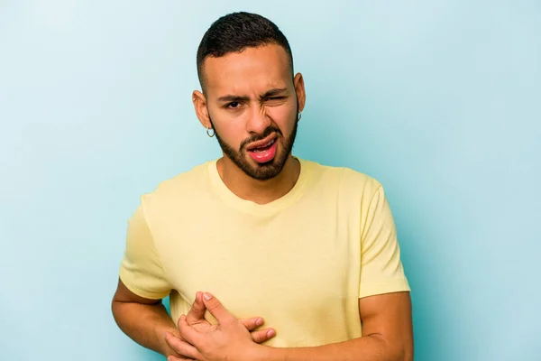 Young Hispanic Man Isolated Blue Background Having Liver Pain Stomach — стоковое фото