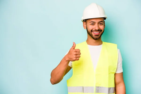 Young Laborer Hispanic Man Isolated Blue Background Smiling Raising Thumb — Stock Photo, Image