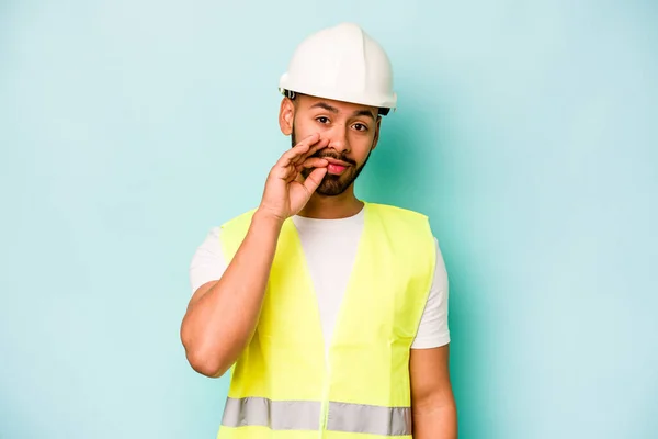 Young Laborer Hispanic Man Isolated Blue Background Fingers Lips Keeping — 스톡 사진