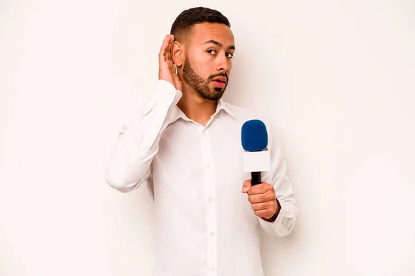 Young Hispanic Presenter Isolated Blue Background Trying Listening Gossip — Stockfoto