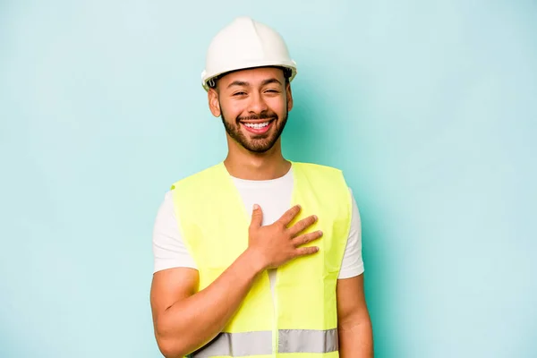 Young Laborer Hispanic Man Isolated Blue Background Laughs Out Loudly — 스톡 사진