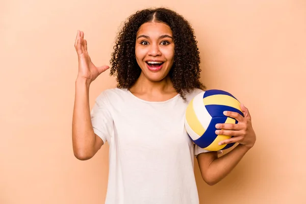 Young African American Woman Playing Volleyball Isolated Beige Background Receiving — стокове фото