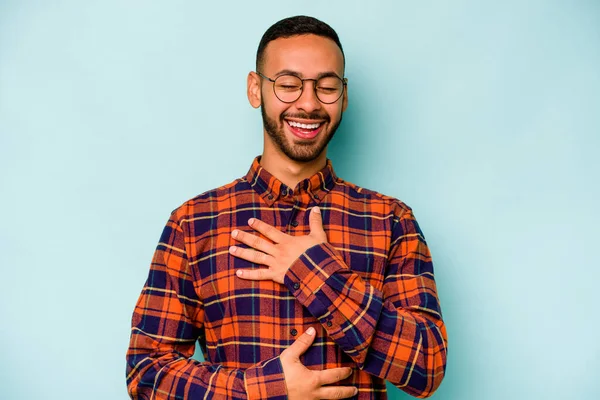 Young Hispanic Man Isolated Blue Background Laughs Happily Has Fun — стоковое фото