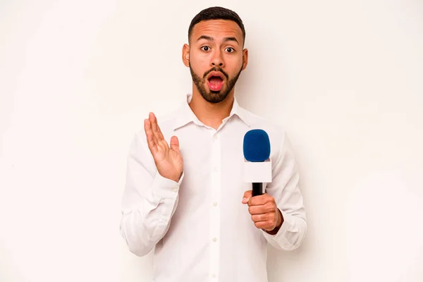 Young Hispanic Presenter Isolated Blue Background Surprised Shocked — Stockfoto