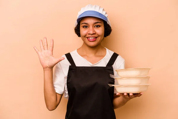 Young Cook Volunteer African American Woman Isolated Beige Background Smiling — Fotografia de Stock