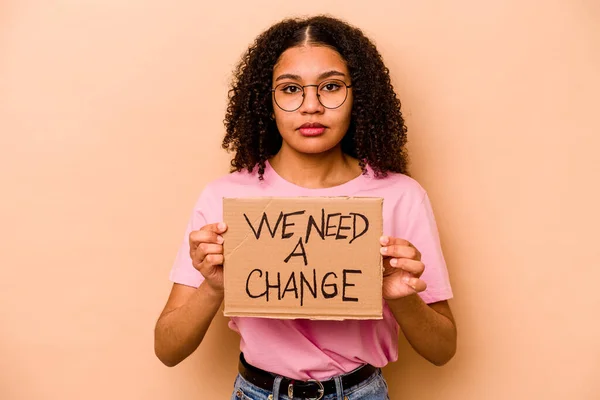Young African American Woman Holding Need Change Placard Isolated Beige — Stok fotoğraf