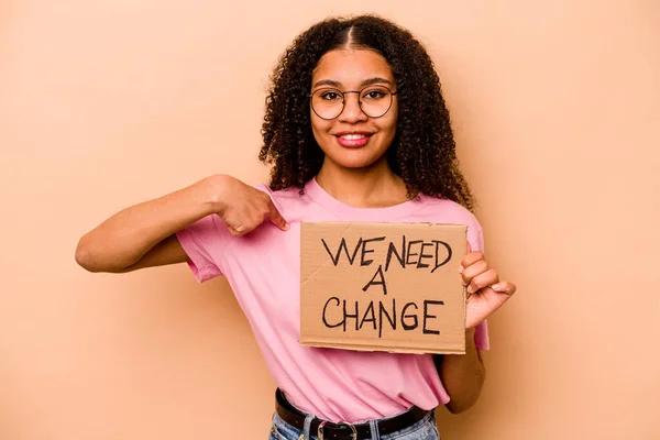 Young African American Woman Holding Need Change Placard Isolated Beige — Stok fotoğraf