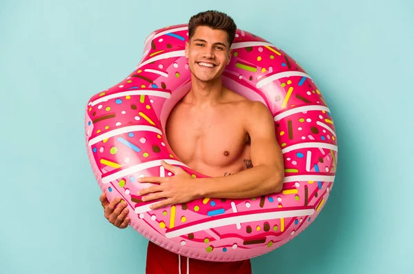 Young Caucasian Man Holding Inflatable Donut Isolated Blue Background Happy —  Fotos de Stock