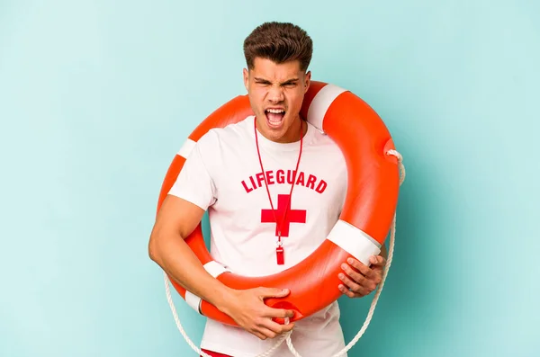 Young Caucasian Lifeguard Isolated Blue Background Screaming Very Angry Aggressive — Fotografia de Stock
