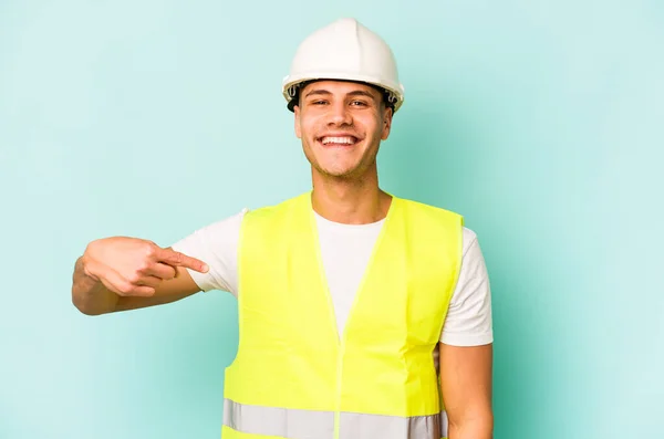 Young Laborer Caucasian Man Isolated Blue Background Person Pointing Hand — Stock Photo, Image