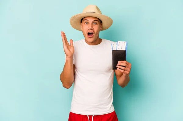Young Caucasian Traveler Man Holding Passport Isolated Blue Background Surprised — Fotografia de Stock