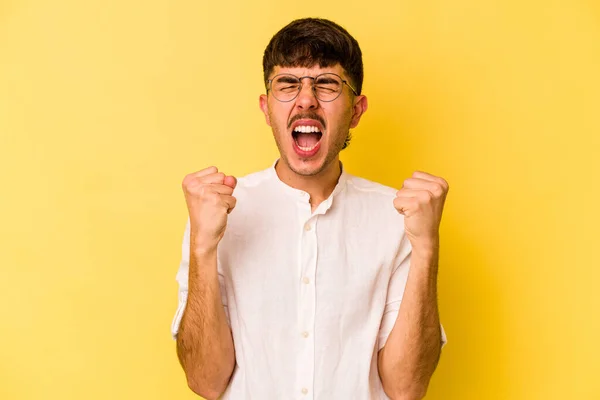 Young Caucasian Man Isolated Yellow Background Cheering Carefree Excited Victory — Stock Photo, Image