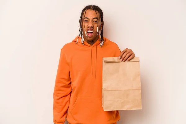 Young African American Man Holding Takeaway Bag Isolated White Background — Stock Photo, Image