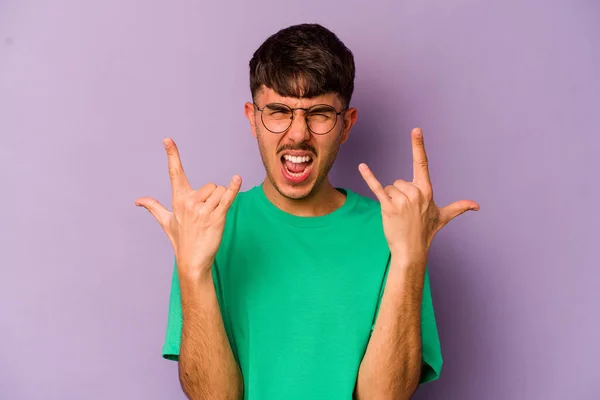Young Caucasian Man Isolated Purple Background Showing Horns Gesture Revolution — Stock Photo, Image