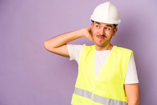 Young Hispanic Worker Man Isolated Purple Background Touching Back Head — Stock Photo, Image