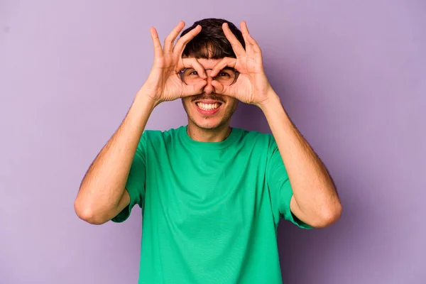 Young Caucasian Man Isolated Purple Background Excited Keeping Gesture Eye — Stock Photo, Image