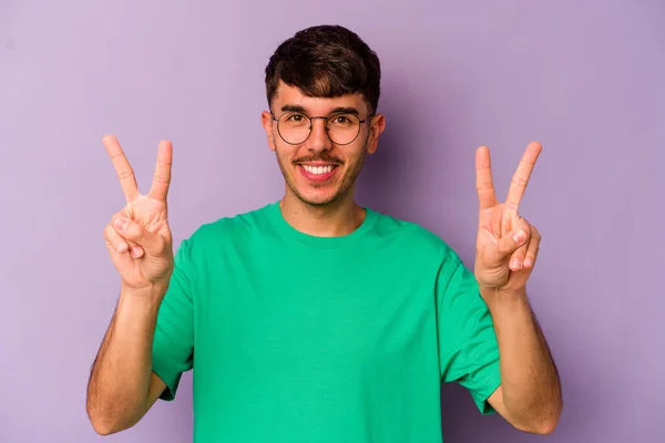 Young Caucasian Man Isolated Purple Background Showing Victory Sign Smiling — Stock Photo, Image