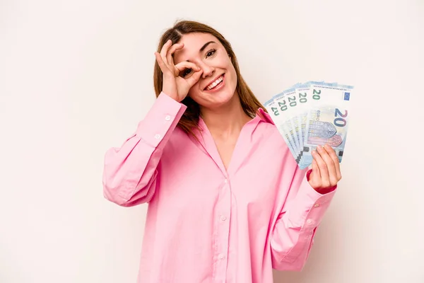 Young Woman Holding Banknotes Isolated White Background Excited Keeping Gesture — Stock Photo, Image