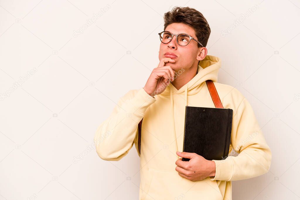 Young student caucasian man isolated on white background looking sideways with doubtful and skeptical expression.